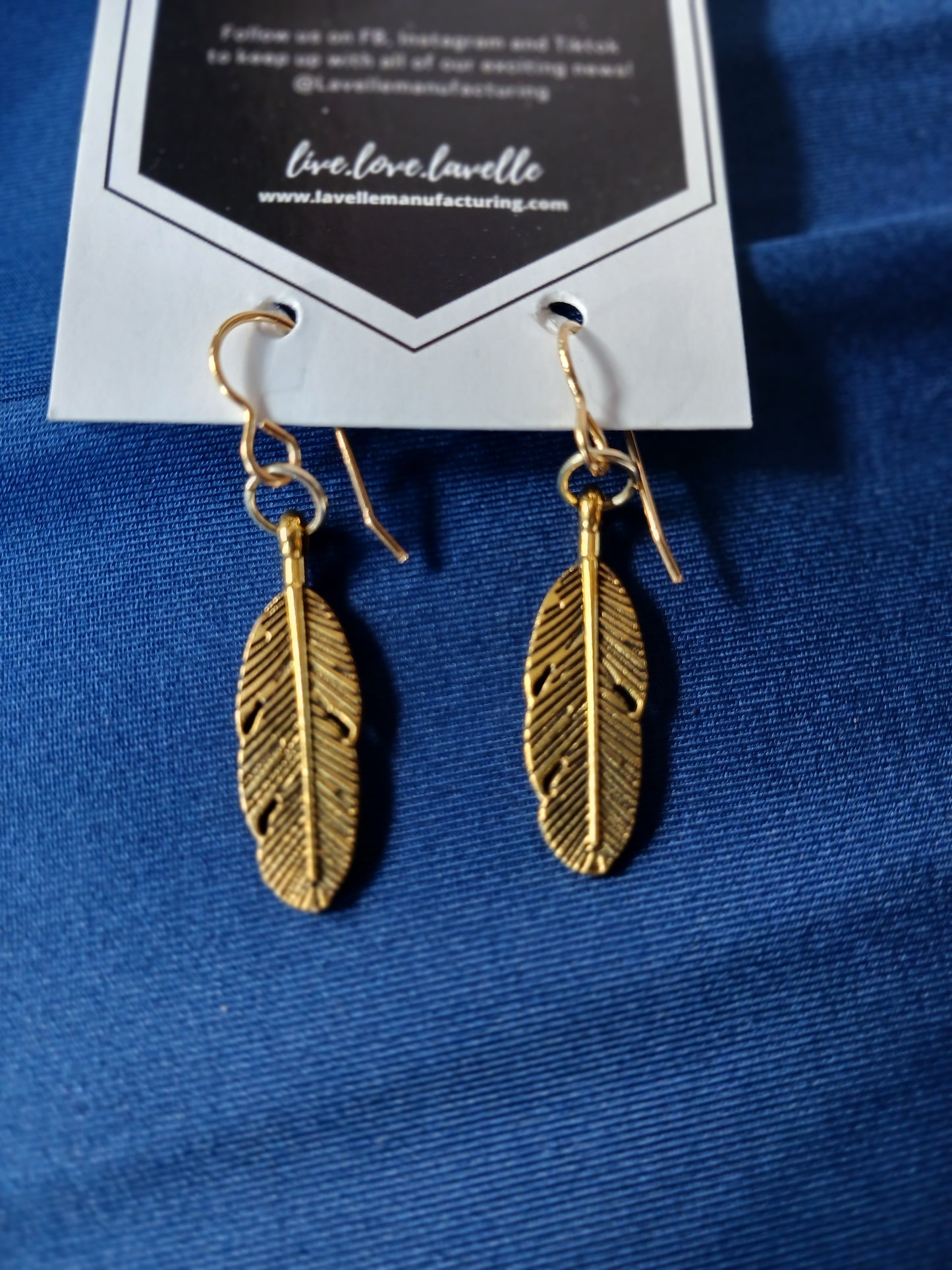 Gold feather earrings