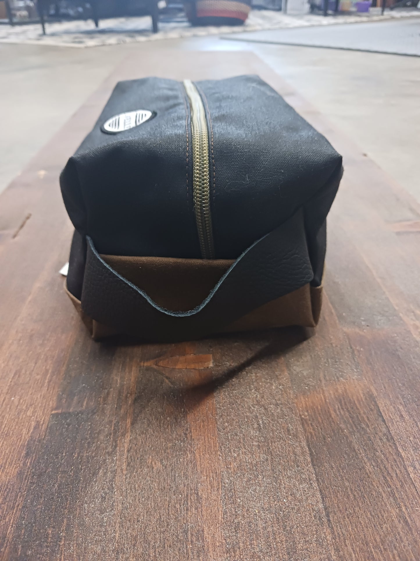 Black and Field tan Waxed canvas dopp kit.