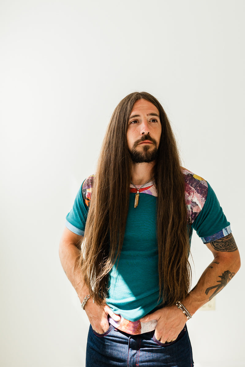 Teal organic knit and purple abstract print in vegetable dyed and recycled knit.