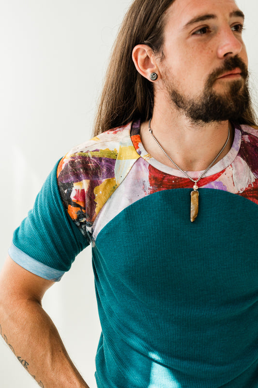 Teal organic knit and purple abstract print in vegetable dyed and recycled knit.