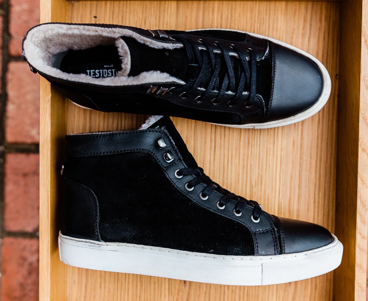 Black leather and cream shearling high top tennis shoe