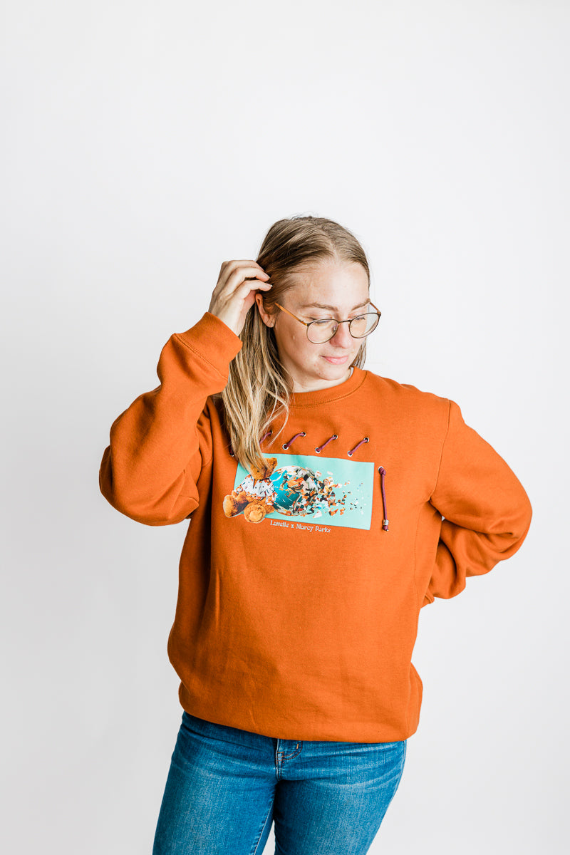 Lavelle x Marcy Parks Organic/Recycled Woven Sweatshirt with Teddy Lavelle Print, Woven ripcord detail and comfort fit. (Rust)