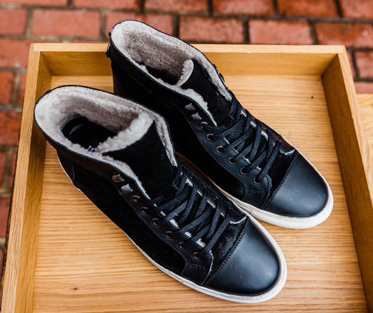 Black leather and cream shearling high top tennis shoe